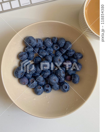 Fresh blueberries in white plate close-up, background Fresh blueberries in white plate close-up, background 118854380