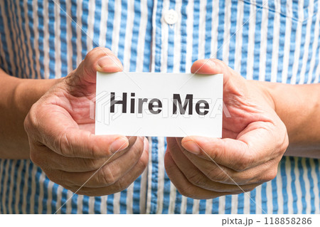 Man holding a sign, Hire Me. Man holding a sign, Hire Me. 118858286
