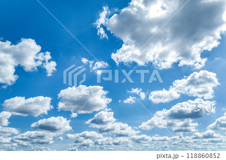 Beautiful blue sky and white cumulus clouds abstract background. Cloudscape background. Blue sky and fluffy white clouds on sunny days. Blue sky and daylight. World Ozone Day. Ozone layer. Summer sky. Beautiful blue sky and white cumulus clouds abstract background. Cloudscape background. Blue sky and fluffy white clouds on sunny days. Blue sky and daylight. World Ozone Day. Ozone layer. Summer sky. 118860852