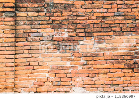 Surface of the red brick wall is old, dirty and covered with black mold. 118860997