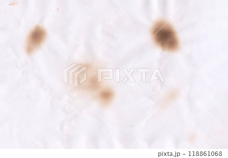 Vintage colored of old paper background with thermal burn marks. Vintage colored of old paper background with thermal burn marks. 118861068