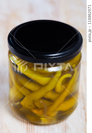 Canned green chili peppers in jar 118862071