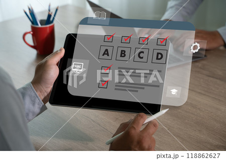 exam online Test with man holding a tablet test or questionnaire show on screen exam online Test with man holding a tablet test or questionnaire show on screen 118862627