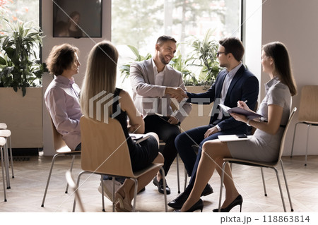 Happy successful business colleagues shaking hands, making deal Happy successful business colleagues shaking hands, making deal 118863814