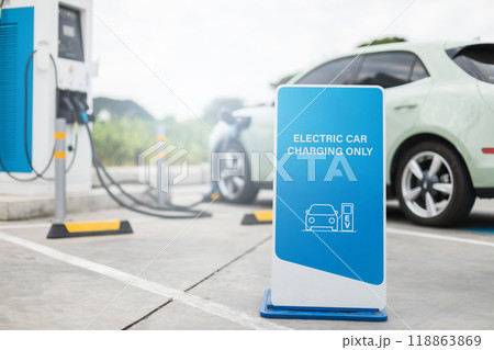 Close up Reserved sign for electric car at Parking lot. Concepts about using electric cars. An electric car recharge in charge station. Close up Reserved sign for electric car at Parking lot. Concepts about using electric cars. An electric car recharge in charge station. 118863869