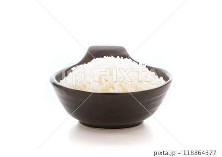 Cooked Thai jasmine rice served in a black bowl against a white background. The contrast between the aromatic, fluffy rice and the sleek black bowl emphasizes the simplicity Cooked Thai jasmine rice served in a black bowl against a white background. The contrast between the aromatic, fluffy rice and the sleek black bowl emphasizes the simplicity 118864377