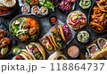Assorted dishes on a dark table, vibrant colors 118864737