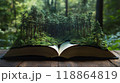 Book surrounded by lush green trees.	 118864819