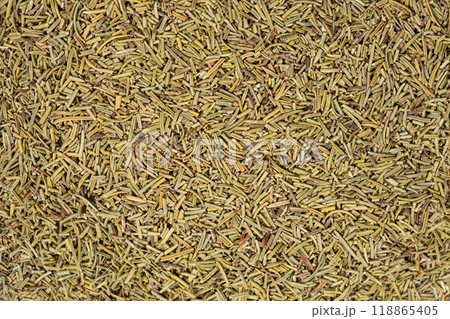 Background crushed dried rosemary leaves top view, seasoning texture. Background crushed dried rosemary leaves top view, seasoning texture. 118865405