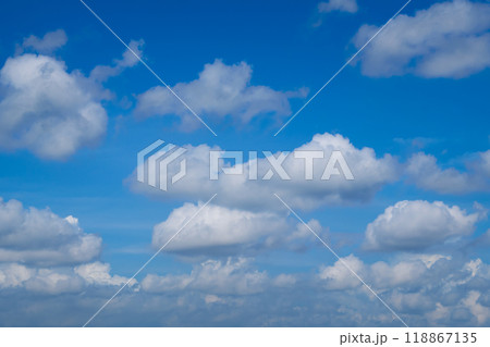 Beautiful blue sky with white clouds forming on sunny day 118867135