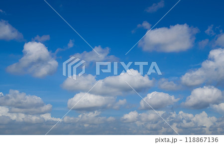 Beautiful blue sky with white clouds forming on sunny day 118867136