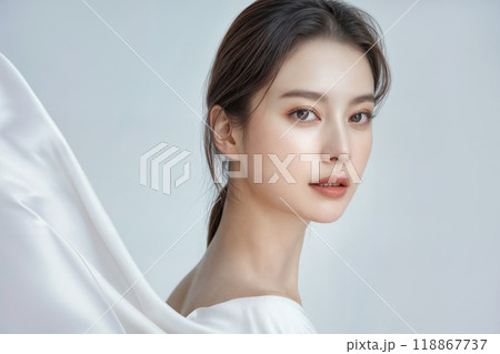 Beautiful korean woman posing with white silk fabric flowing in the wind 118867737