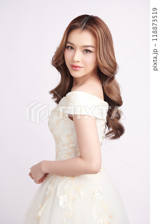Beautiful young asian woman in wedding dress on white background, Beautiful young asian woman in wedding dress on white background, 118873519