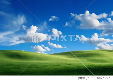 A beautiful summer or spring landscape with green grass on the hills and green fields. The blue sky is filled with white clouds and bright sunlight. Nature as a background. A beautiful summer or spring landscape with green grass on the hills and green fields. The blue sky is filled with white clouds and bright sunlight. Nature as a background. 118873997