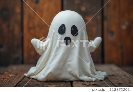 portrait of a cute little ghost in autumn decoration, Halloween holiday theme 118875202