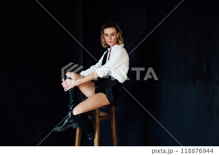 Beautiful fashion blonde woman posing in photo studio Beautiful fashion blonde woman posing in photo studio 118876944