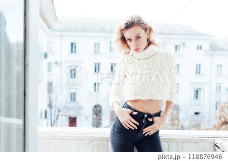 Beautiful fashion blonde woman posing in photo studio 118876946