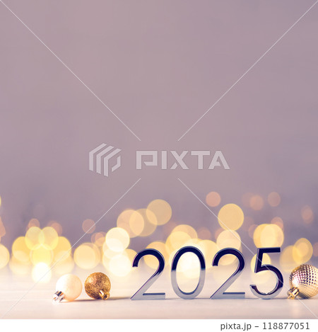 Metal numbers 2025 on table with bokeh lights. 118877051