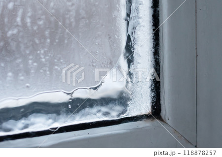 The Beautifully Frosted Window Corner Adorned with Vapor and Moisture Creates Atmosphere The Beautifully Frosted Window Corner Adorned with Vapor and Moisture Creates Atmosphere 118878257