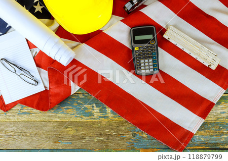 Labor Day celebration with safety gear flag of United States of America against rustic wooden backdrop 118879799