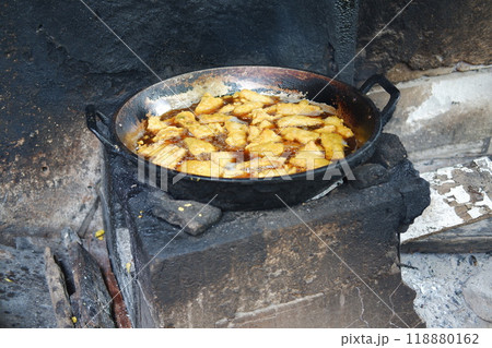 Fried tofu in a pan on the fire. Selective focus. 118880162