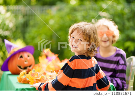 Family decorating home. Halloween arts and crafts. Family decorating home. Halloween arts and crafts. 118881671