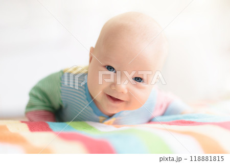 Little baby on white bed Little baby on white bed 118881815