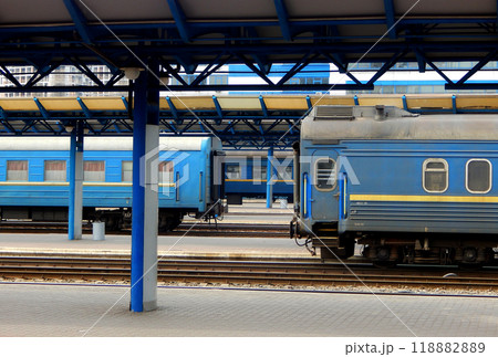 Passenger railway cars covered with dust and dirt near the railroad station platform Passenger railway cars covered with dust and dirt near the railroad station platform 118882889