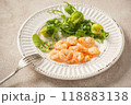 Shrimp poached in coconut oil, served with greens and Brussels sprouts 118883138