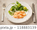 Shrimp poached in coconut oil, served with greens and Brussels sprouts 118883139