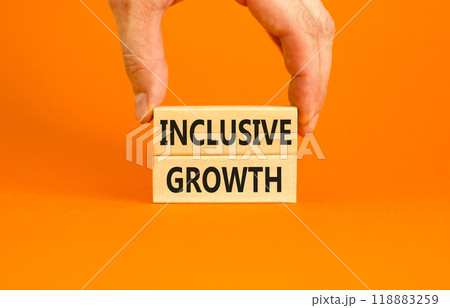 Inclusive growth symbol. Concept words Inclusive growth on beautiful wooden blocks. Beautiful orange table orange background. Businessman hand. Business inclusive growth concept. Copy space. 118883259