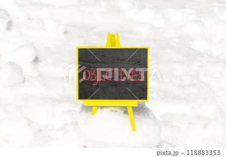 Objectives symbol. Concept word Objectives on beautiful chalk blackboard. Beautiful white snow background. White snow. Business objectives concept. Copy space. Objectives symbol. Concept word Objectives on beautiful chalk blackboard. Beautiful white snow background. White snow. Business objectives concept. Copy space. 118883353