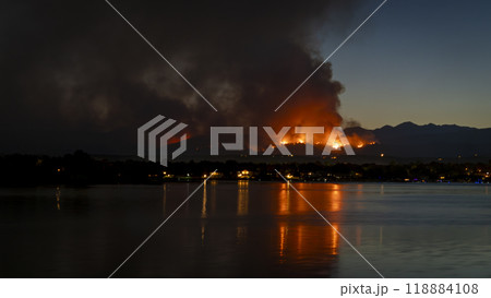 wildfire at Colorado foothills west of Loveland, smoke plume from Alexander Mountain fire as seen at sunset from Boyd Lake, July 29, 2024 wildfire at Colorado foothills west of Loveland, smoke plume from Alexander Mountain fire as seen at sunset from Boyd Lake, July 29, 2024 118884108