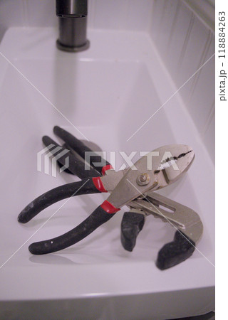 Pliers tools in bathroom sink Pliers tools in bathroom sink 118884263