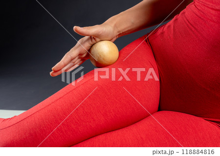 Myofascial relaxation of the leg muscles with a massage ball. Prevent leg fatigue, self massage tool Myofascial relaxation of the leg muscles with a massage ball. Prevent leg fatigue, self massage tool 118884816