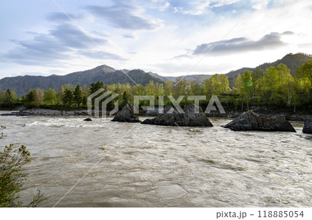 Elekmonar, Altai Republic, Suspension bridge over fast mountain river Katun. Sharp rocky islands in the middle of Katun river 118885054
