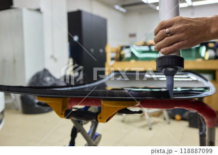Installing windshield on a car with automotive design Installing windshield on a car with automotive design 118887099