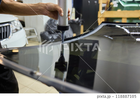 Installing windshield on a car with automotive design 118887105