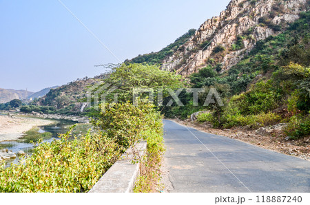 Village road through a rocky terrain Village road through a rocky terrain 118887240