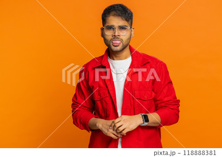 Displeased funny bully Indian man showing tongue making silly faces, fooling around, joking, teasing 118888381