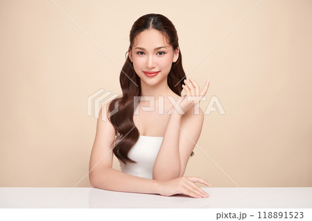 Beautiful young asian woman with clean fresh skin on beige background, Face care, Facial treatment, Cosmetology, beauty and spa, Asian women portrait. 118891523