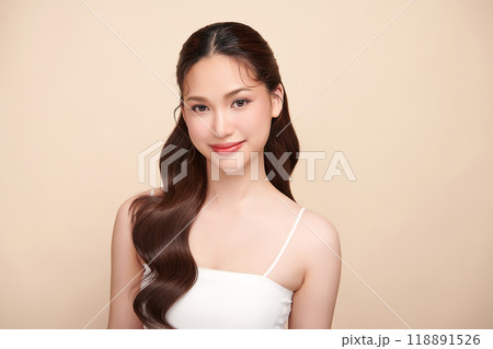 Beautiful young asian woman with clean fresh skin on beige background, Face care, Facial treatment, Cosmetology, beauty and spa, Asian women portrait. Beautiful young asian woman with clean fresh skin on beige background, Face care, Facial treatment, Cosmetology, beauty and spa, Asian women portrait. 118891526