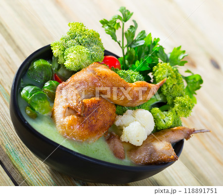 Cabbage soup with quails and greens 118891751