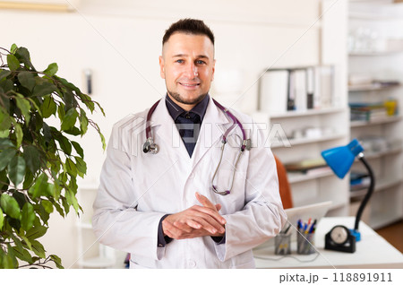 Portrait of male physician in office 118891911