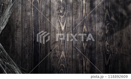 Spooky creepy cobweb spiders web covered a wooden background 118892609