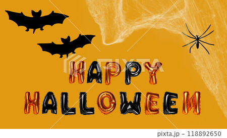 Row of balloon says Happy Halloween with bats and spider on a colored background Row of balloon says Happy Halloween with bats and spider on a colored background 118892650