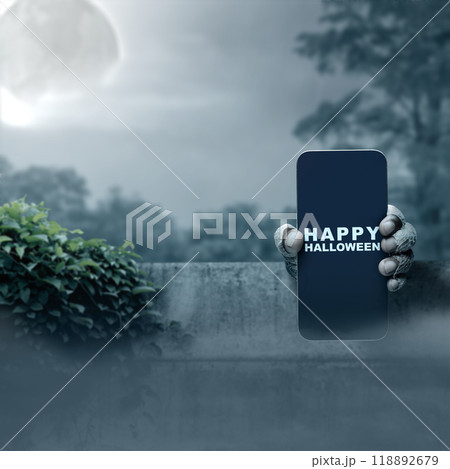 Mummy hands have dirty bandages on them. Mummy, devil, evil, satan, or zombie hands holding a mobile phone with a Happy Halloween sign 118892679