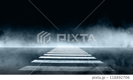 Closeup view of pedestrian crosswalk on the foggy road. The road is empty and the sky is dark 118892706