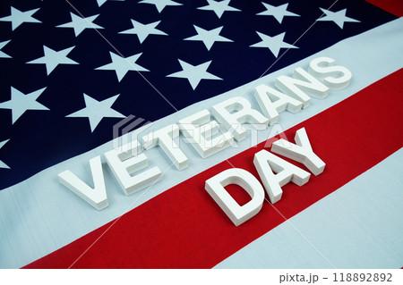 Happy Veterans Day alphabet letters and American flag background 118892892