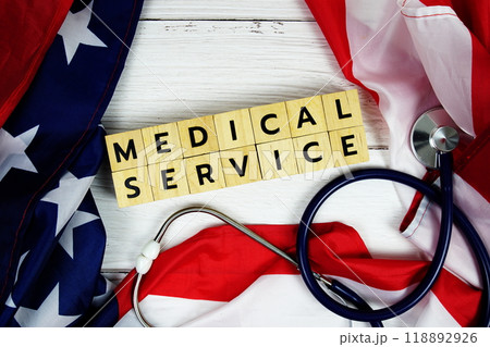 Medical Service alphabet letters with USA flag on wooden background 118892926